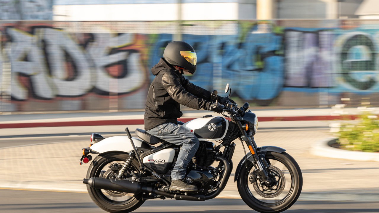 A motorcycle being ridden through an industrial area of LA